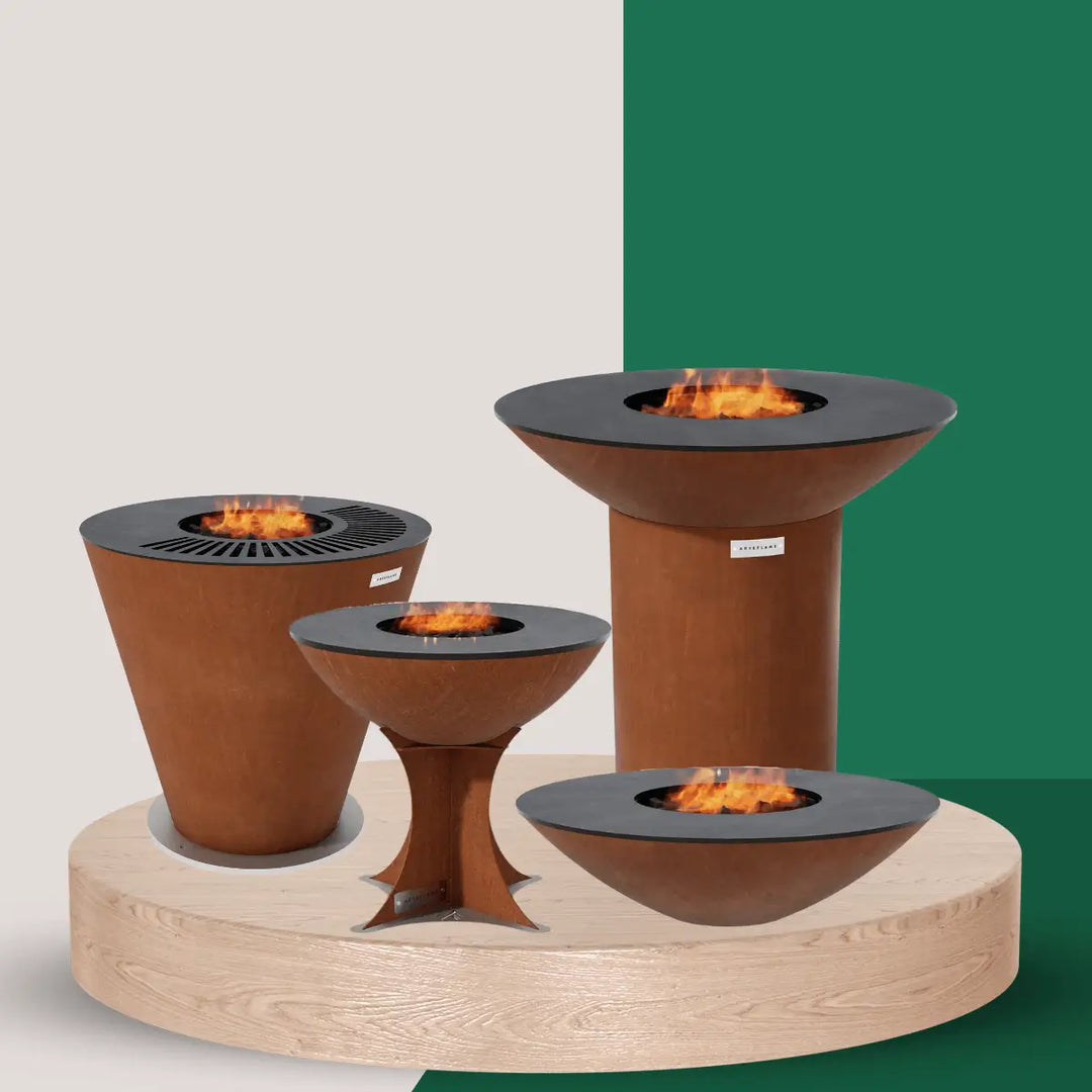Arteflame grills collection with corten steel outdoor fire grills in various sizes featuring circular cooktops and live fire center flames.