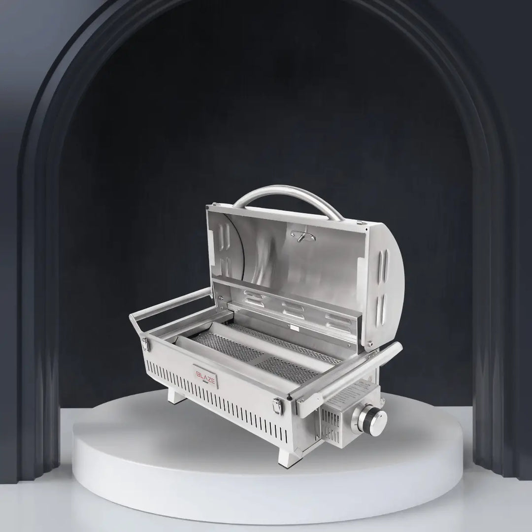 Blaze freestanding stainless steel gas grill with open lid and control knob, compact outdoor cooking grill for portable grilling performance.