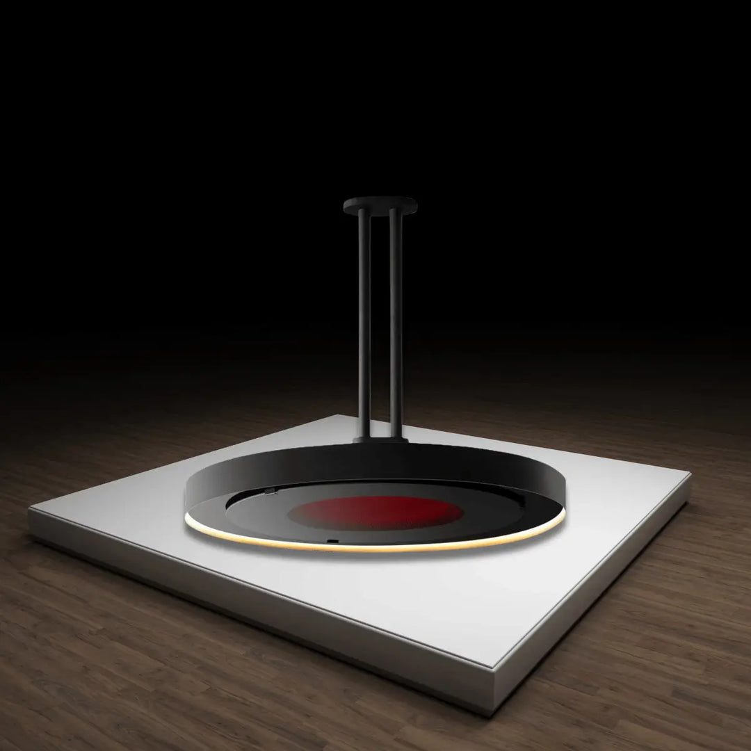Bromic Eclipse Smart-Heat electric heater with circular ceiling-mounted design and glowing heat element in a modern setting.