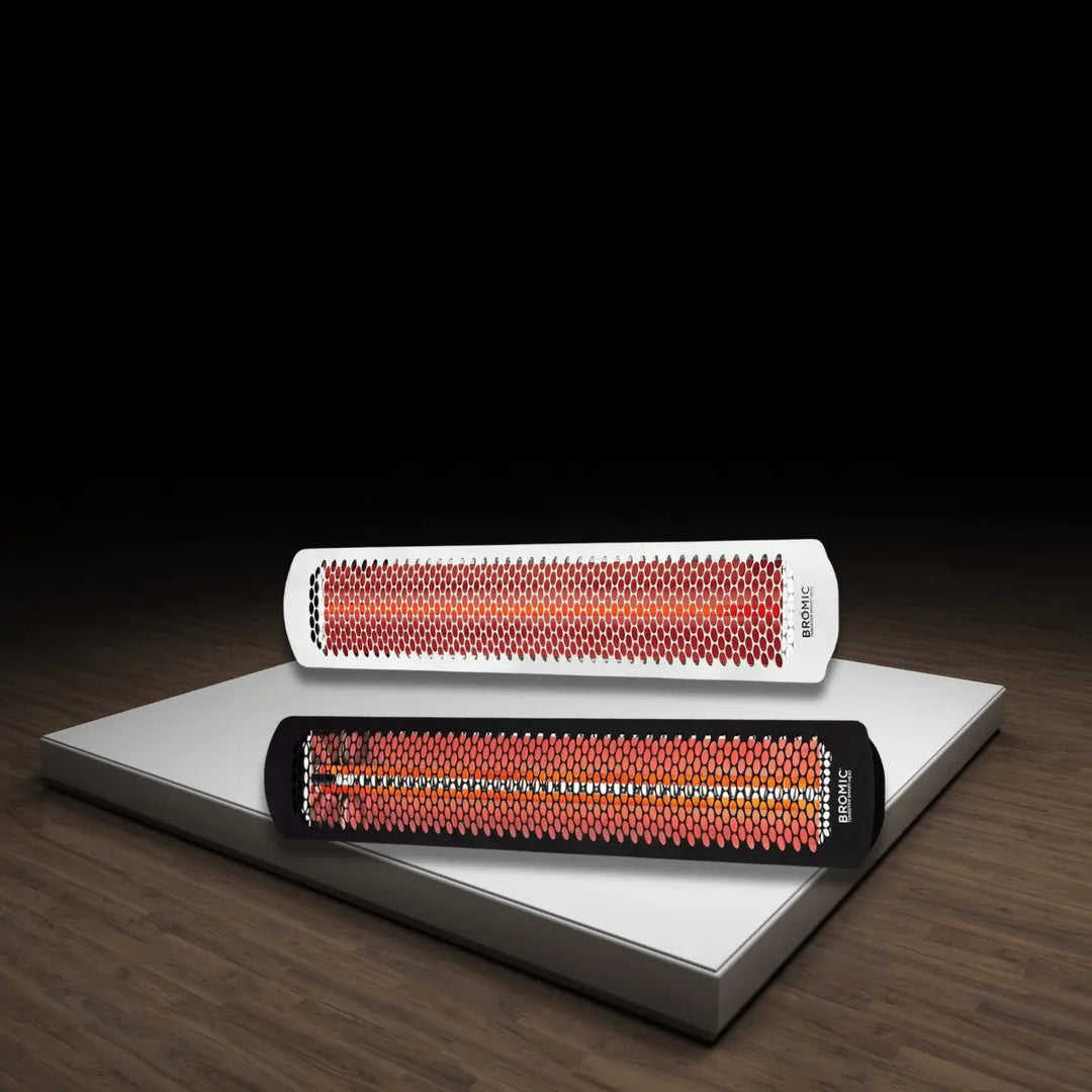 Bromic Tungsten Smart-Heat electric outdoor heaters in black and white with glowing infrared elements on a modern display platform.