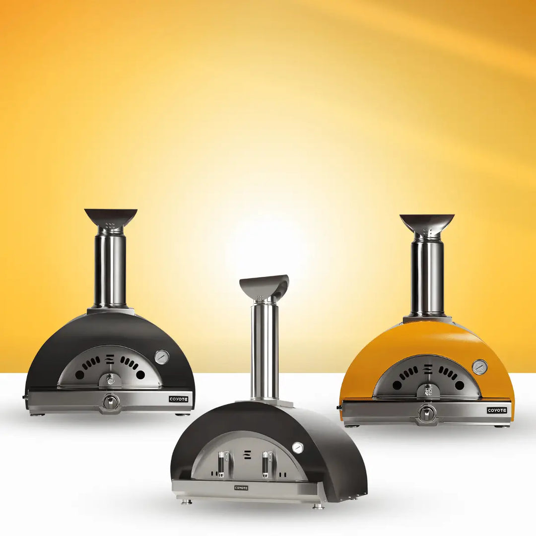 Coyote Outdoor Living pizza ovens collection with black and yellow dome ovens, built-in chimneys, and stainless steel outdoor cooking design.