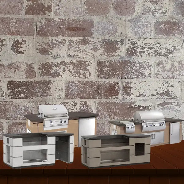 Fire Magic pre-fab grill islands systems collection featuring ready-to-install outdoor kitchen island setups with built-in grills, storage compartments, and countertop surfaces, displayed on a wooden surface with a rustic brick wall background.