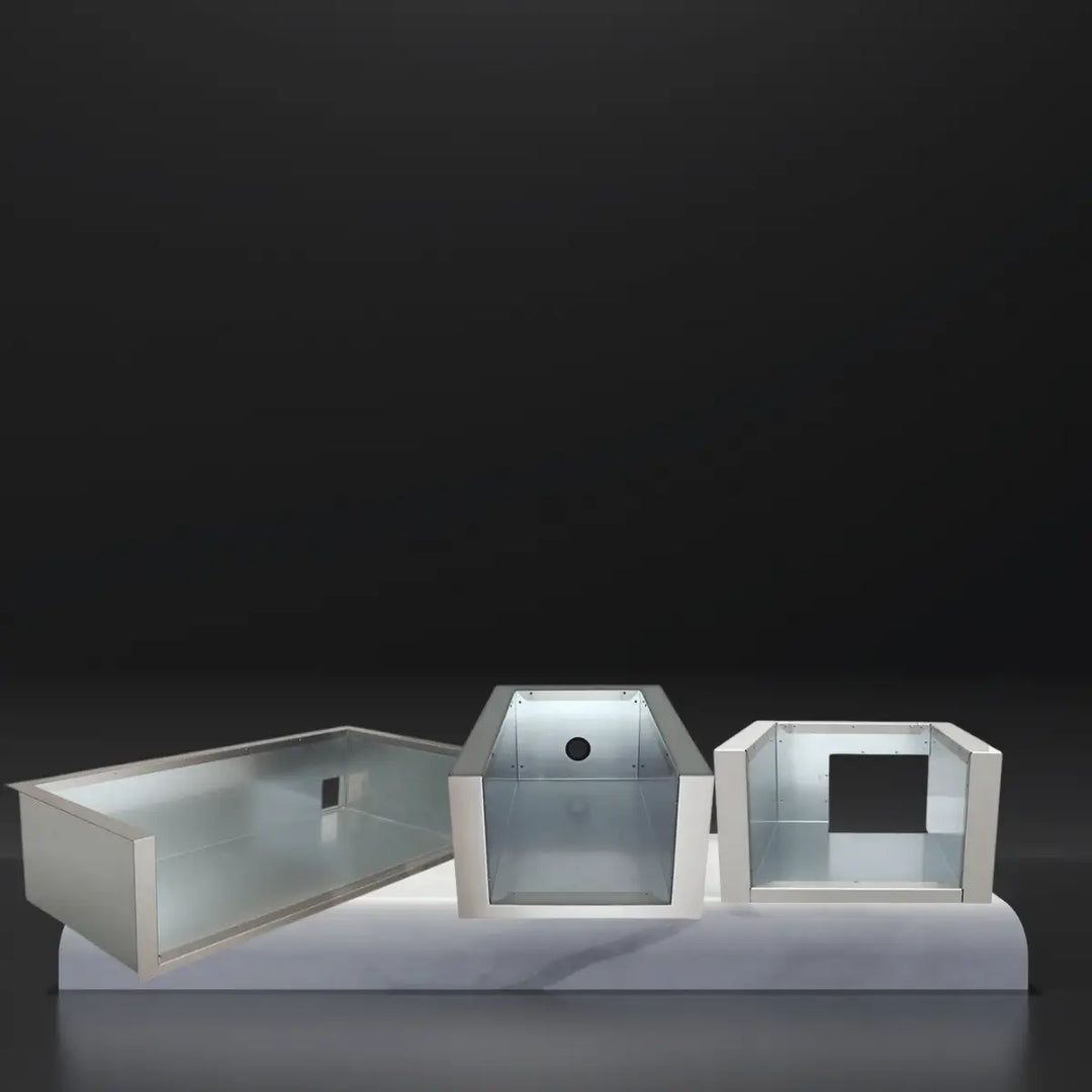 RCS insulated jackets collection featuring stainless steel grill insulation liners in multiple sizes, designed for built-in grill installations, displayed on a sleek platform against a dark background.