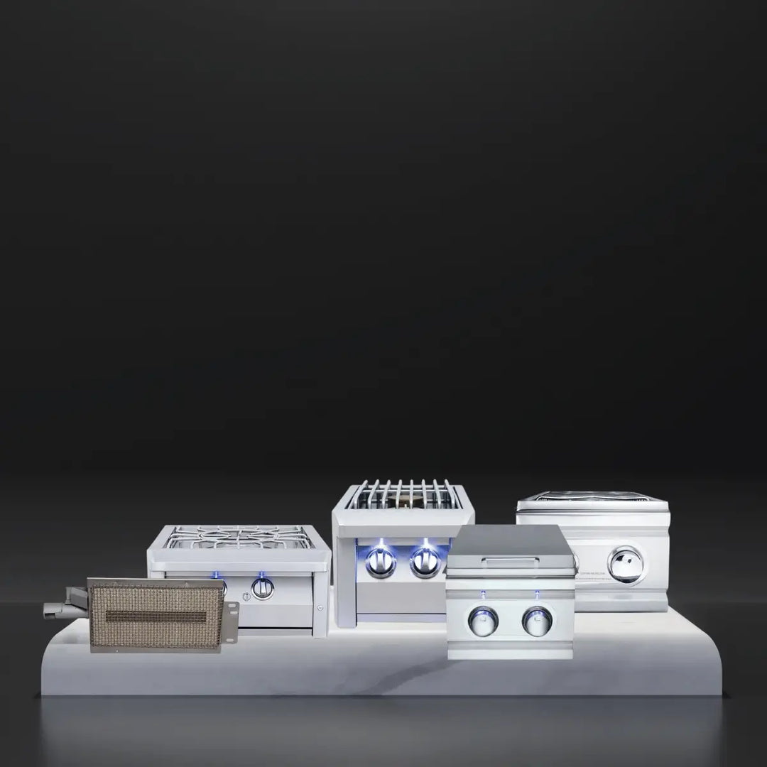 RCS side burners collection featuring stainless steel single and double side burners, power burners, and sear burner components with control knobs displayed on a platform against a dark background.