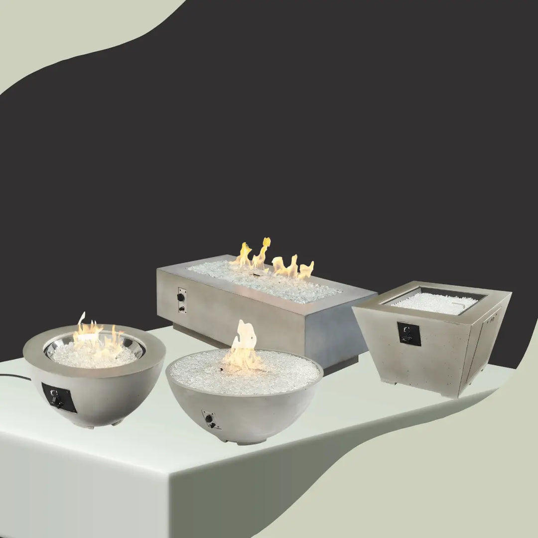 The Outdoor GreatRoom Cove collection featuring modern gas fire pits, round fire bowls, and rectangular fire tables with white fire glass.