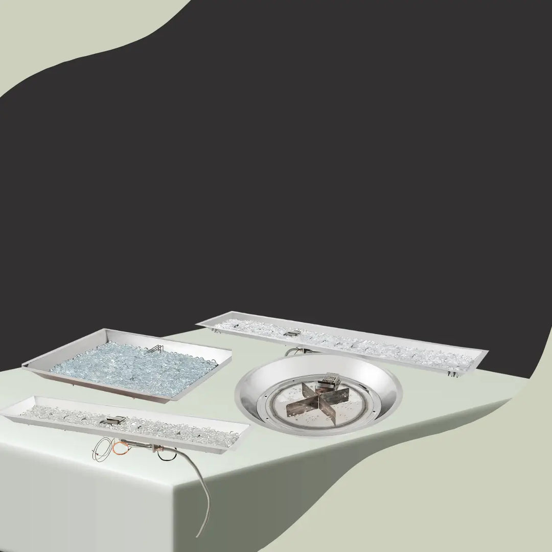 The Outdoor GreatRoom Crystal Fire Plus burners and kits collection featuring linear, round, and square gas fire pit burners with clear fire glass.