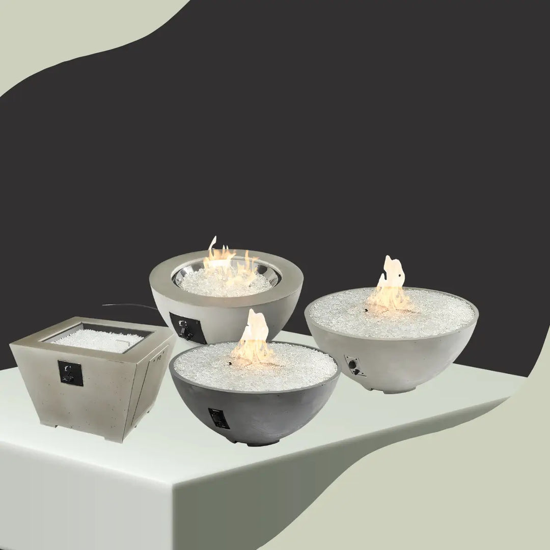 The Outdoor GreatRoom fire pit bowls collection featuring round concrete gas fire bowls and square fire pit with white fire glass design.