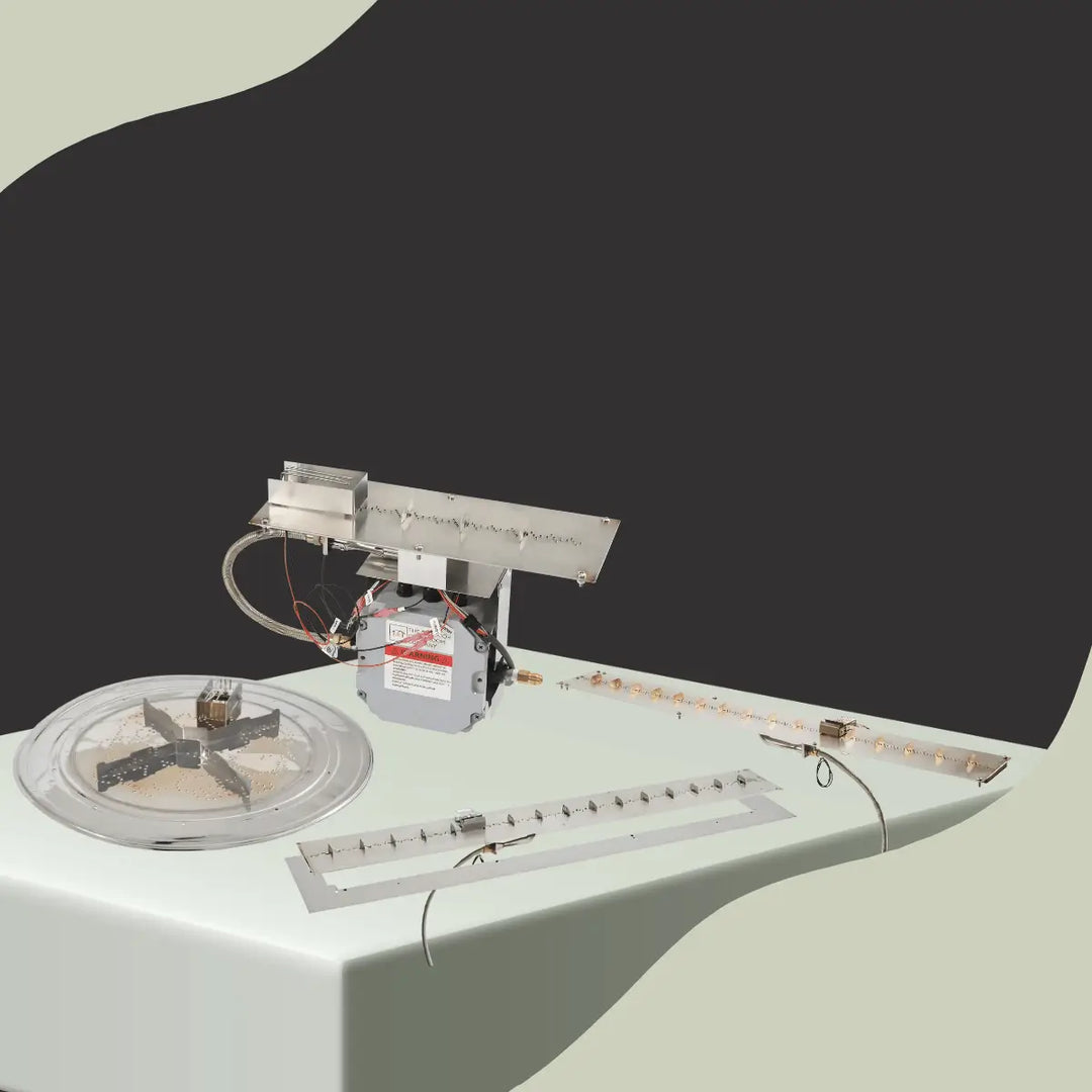 The Outdoor GreatRoom Company fire pit burner kits collection with stainless steel linear burners, ignition systems, and round burner components for outdoor fire features.