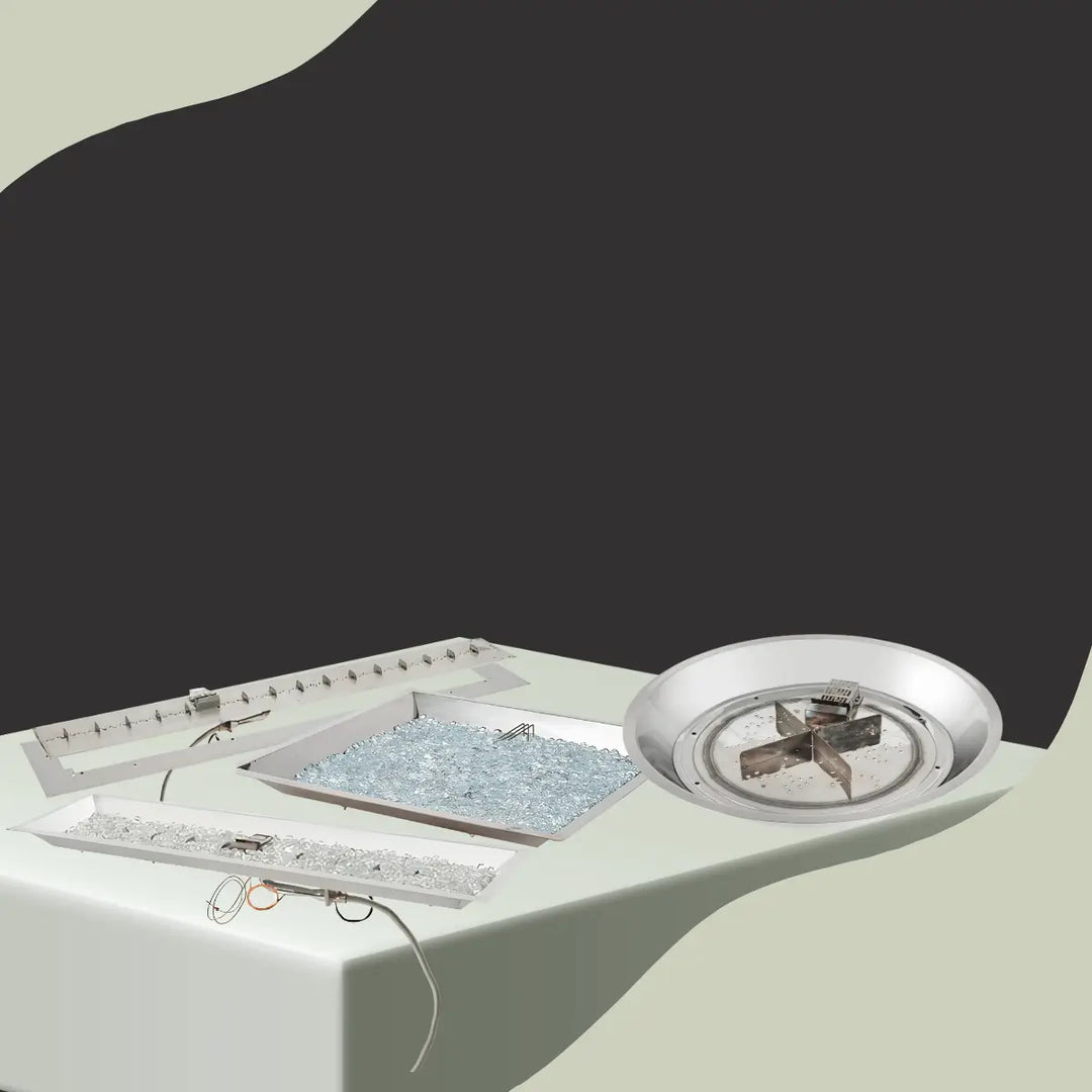 The Outdoor GreatRoom Company fire pit collection inserts collection with stainless steel linear burners, round and square inserts with fire glass.