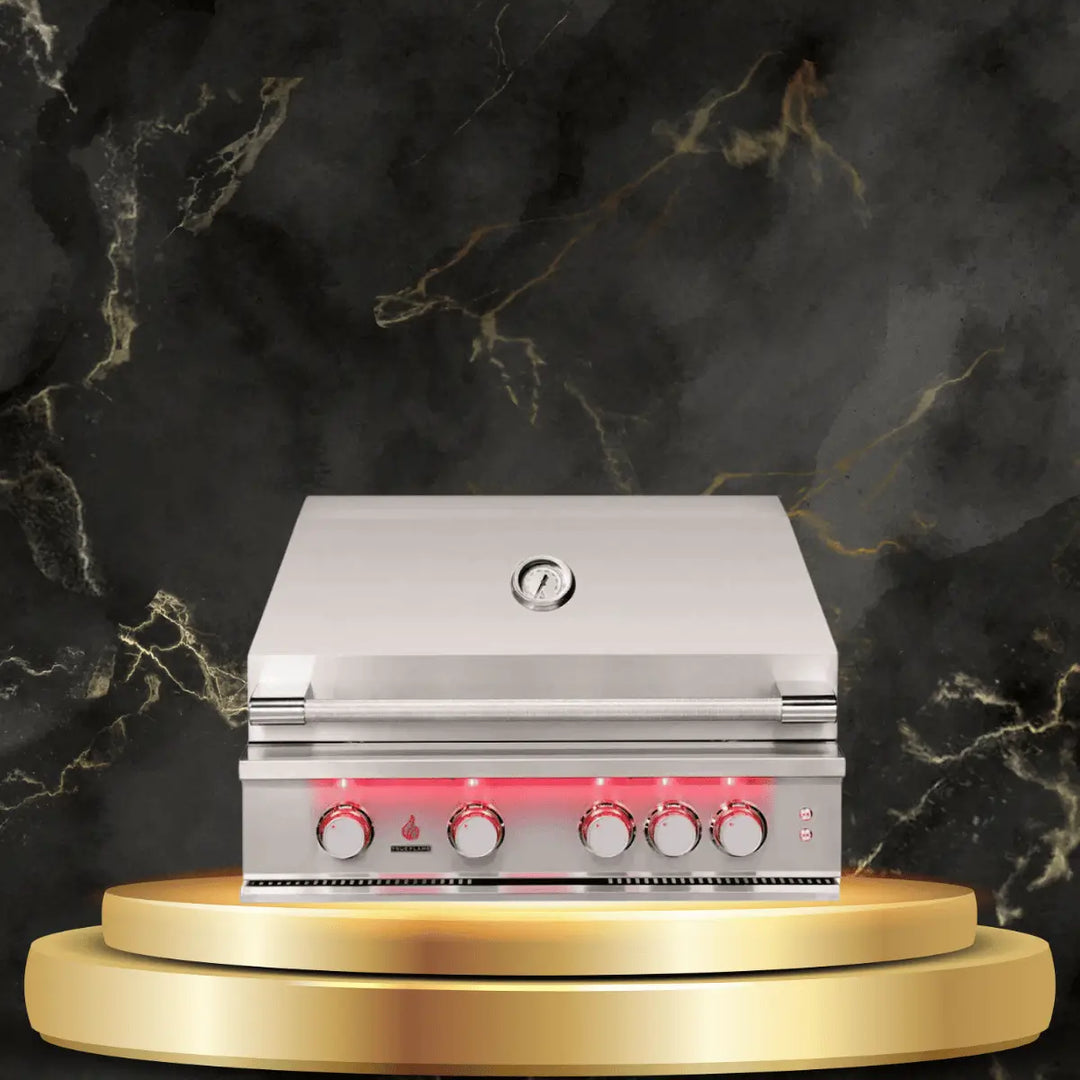 TrueFlame built-in gas grill with stainless steel finish, temperature gauge, and illuminated control knobs on luxury outdoor display platform