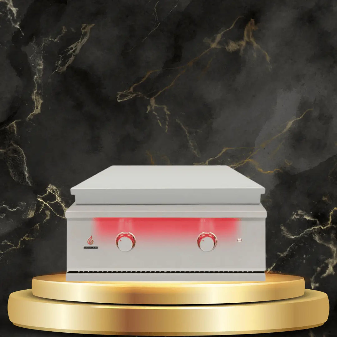 TrueFlame stainless steel griddle with illuminated control knobs on luxury display platform, ideal for outdoor cooking setups.