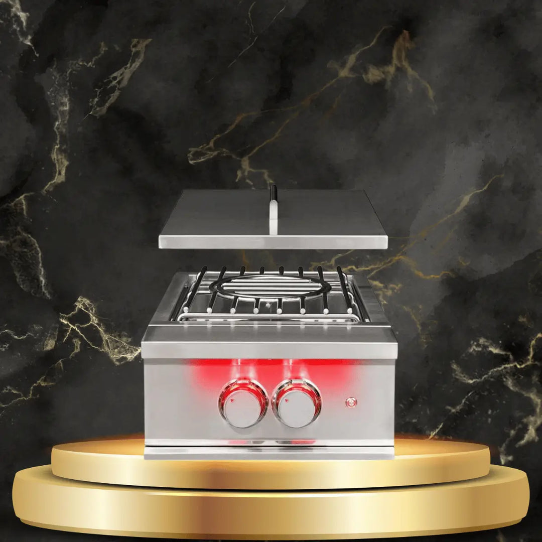 TrueFlame power burner with stainless steel design, open lid, and dual control knobs in a luxury outdoor kitchen display.